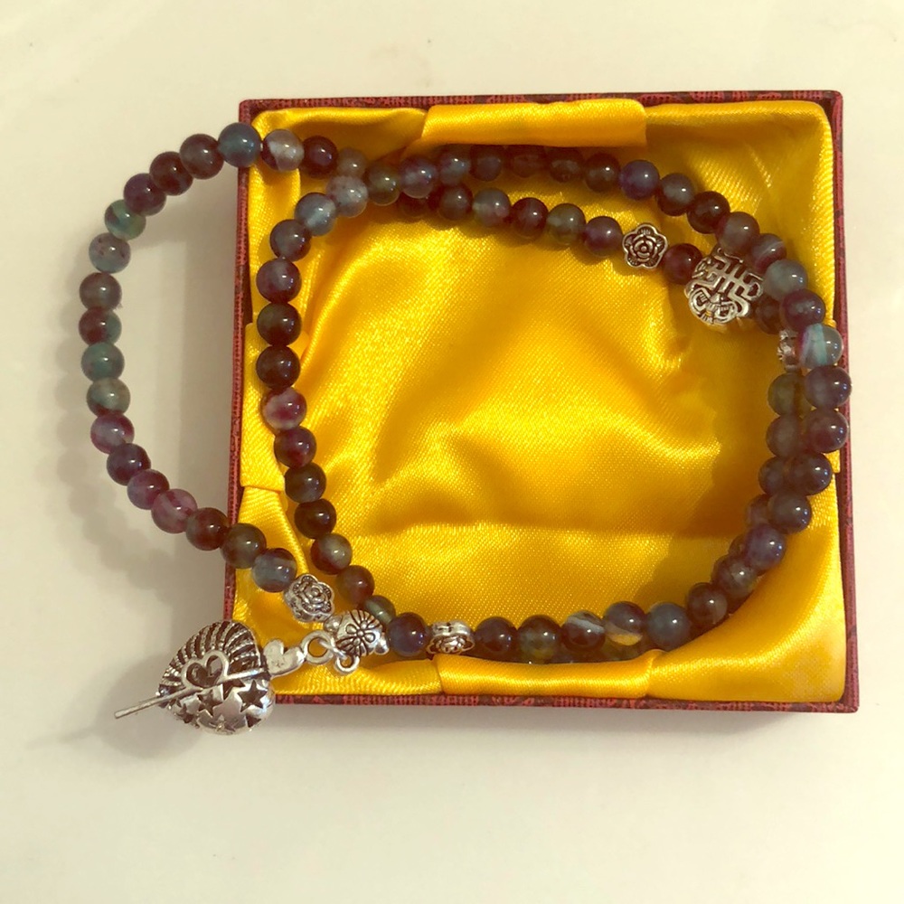 Mixed stones with silver tone charms necklace
